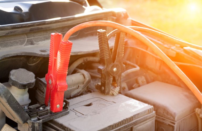 Battery cable attached to a vehicle's battery