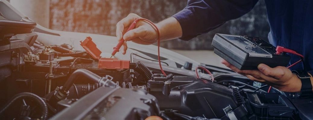 Technician inspecting a vehicle
