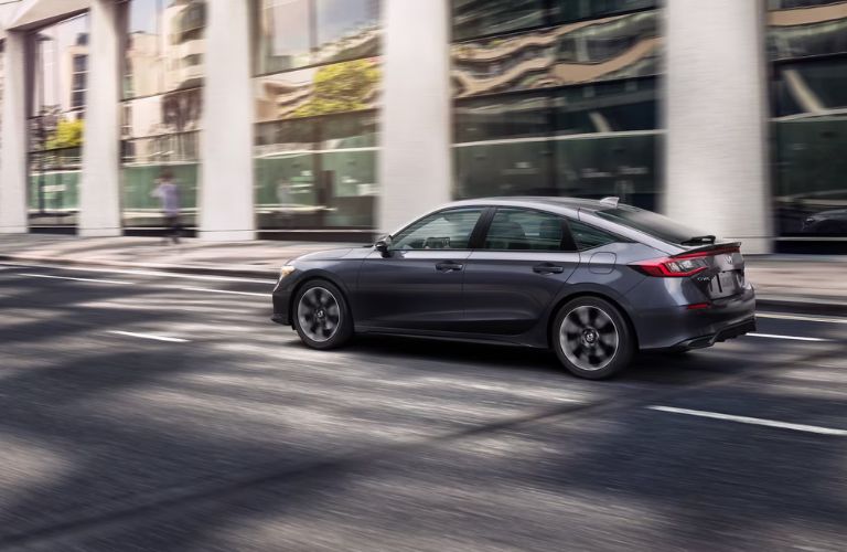 side view of the 2025 Honda Civic Hatchback on the road