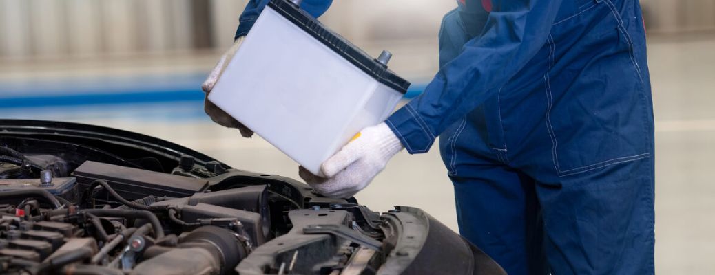 Technician replacing a battery