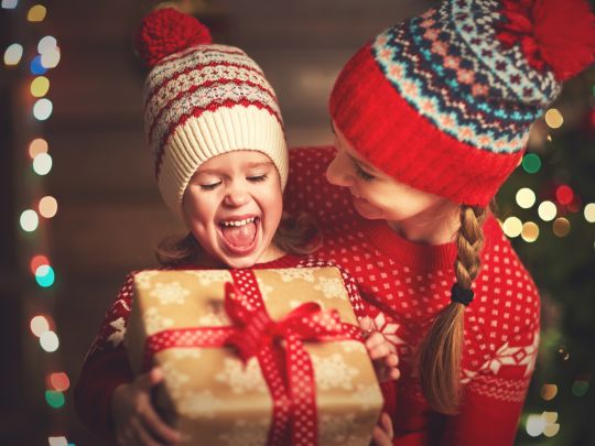 A mother giving gift to her kid