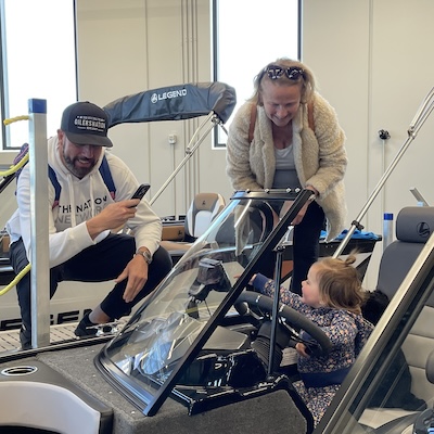 Sherwood Powersports & Marine grand opening boat with child
