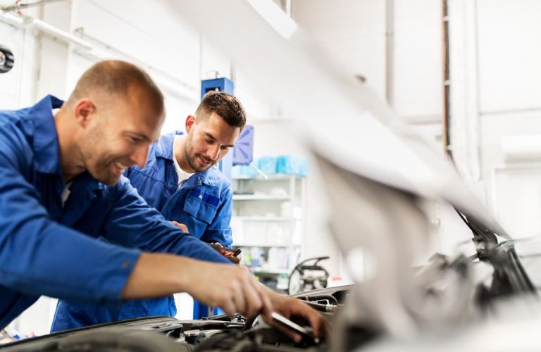 Mechanic looking at a car engine