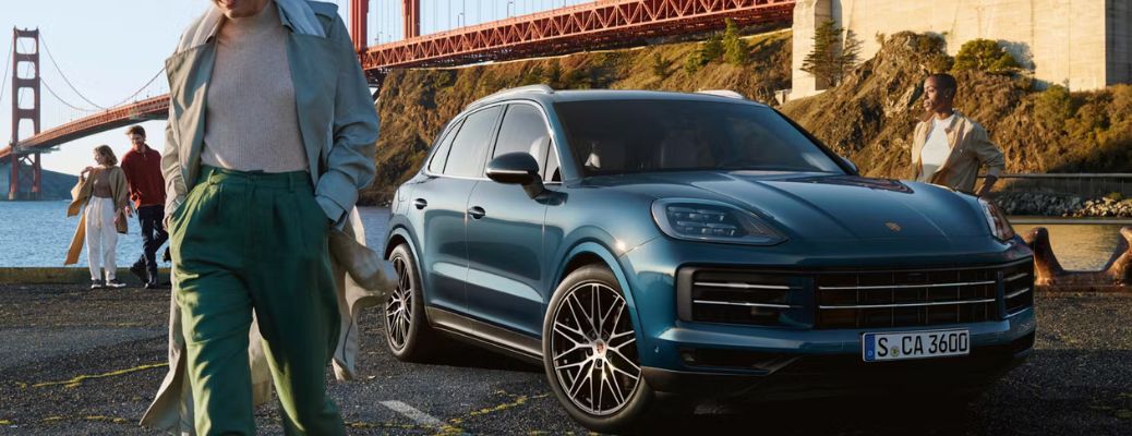 2026 Porsche Cayenne GTS Blue parked near bridge