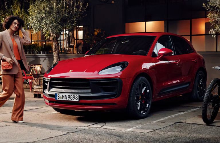2026 Porsche Macan GTS Red parked outside house