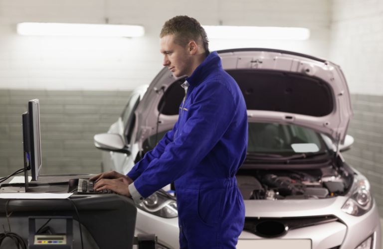 A mechanic working on a vehicle