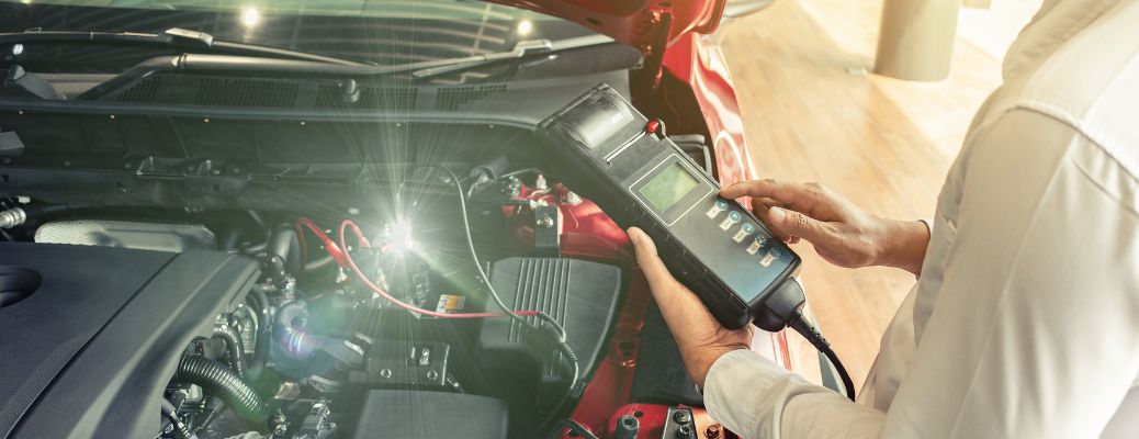 Hand of a mechanic working on a vehicle