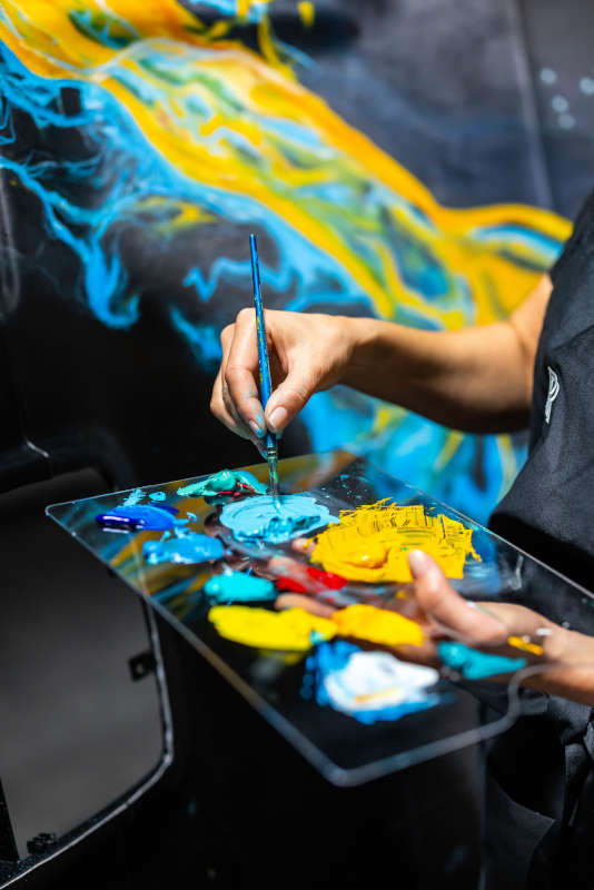 An artist painting the interior of the Rolls-Royce Cullinan Cosmos 

22/02/2024 - Ciaran McCrickard / Mindworks - RRMC