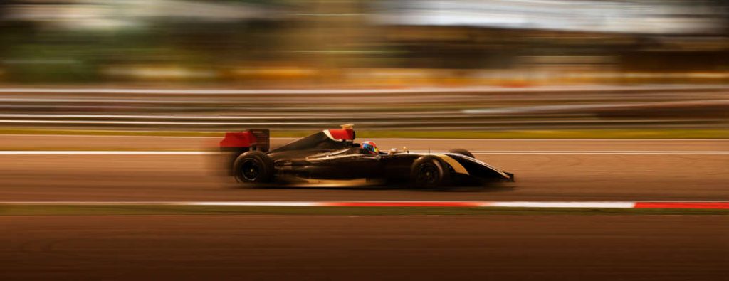 A Formula One racer on the track - one of the best events for exotic car owners near Miami.