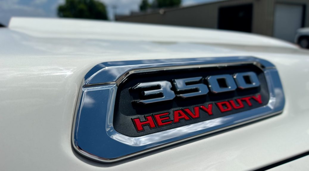 Close-up of a Ram 5500 Heavy Duty badge representing diesel truck durability
