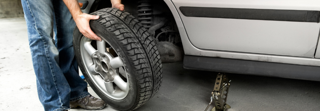 A mechanic checking a tire