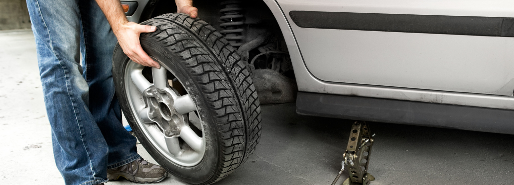 A mechanic checking a tire