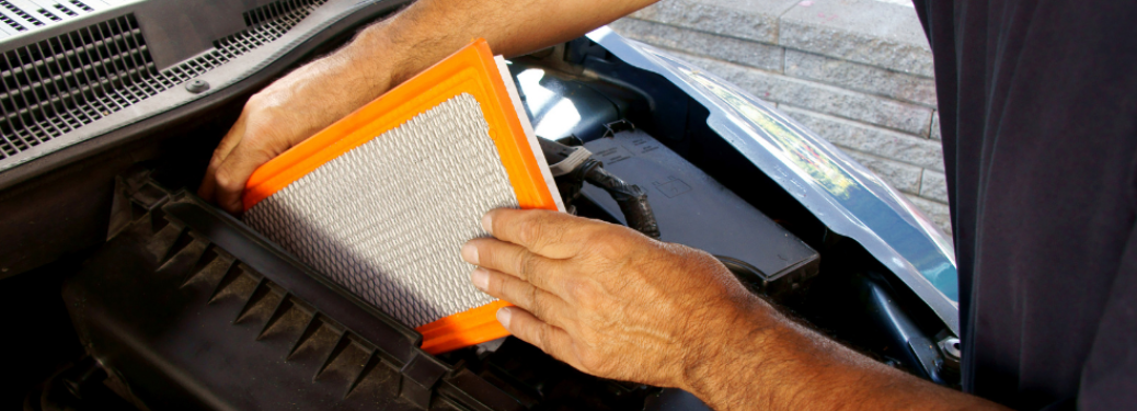 Man changing the cabin air filter