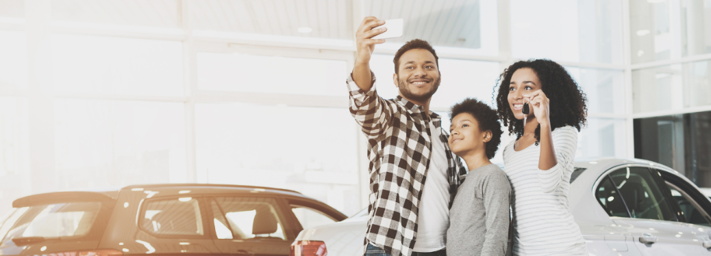 A family showing keys of a vehicle