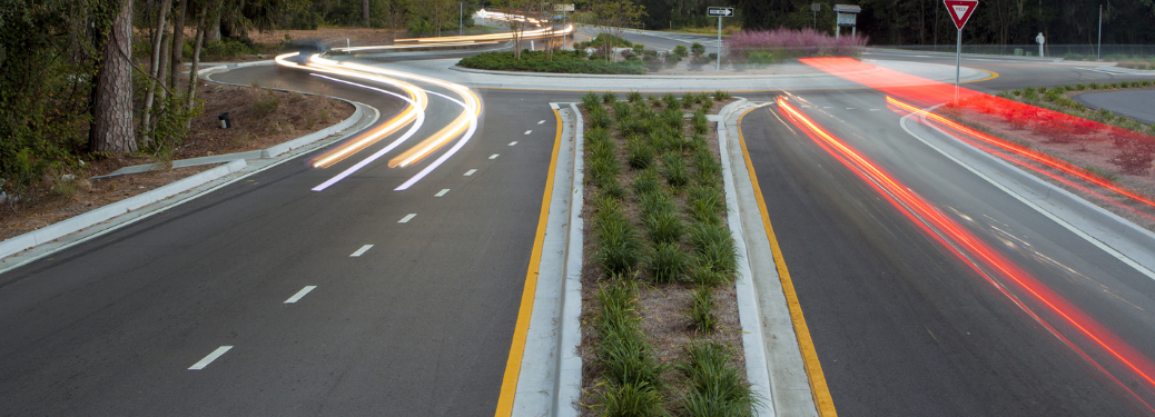 Traffic roundabout with light trails