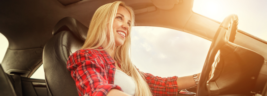 A woman driving a vehicle