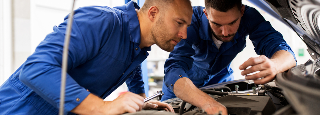Mechanics checking a vehicle