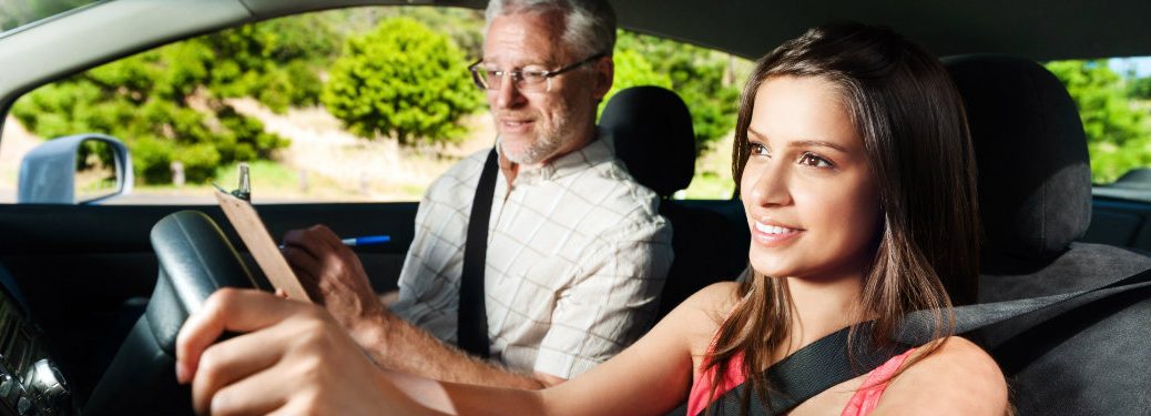 girl learning to drive in driver's ed
