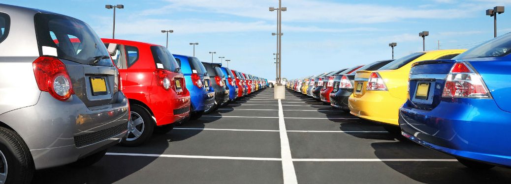 cars in dealership parking lot