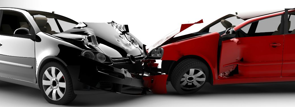 Side view of two cars that collided with one another and their crumpled front ends.