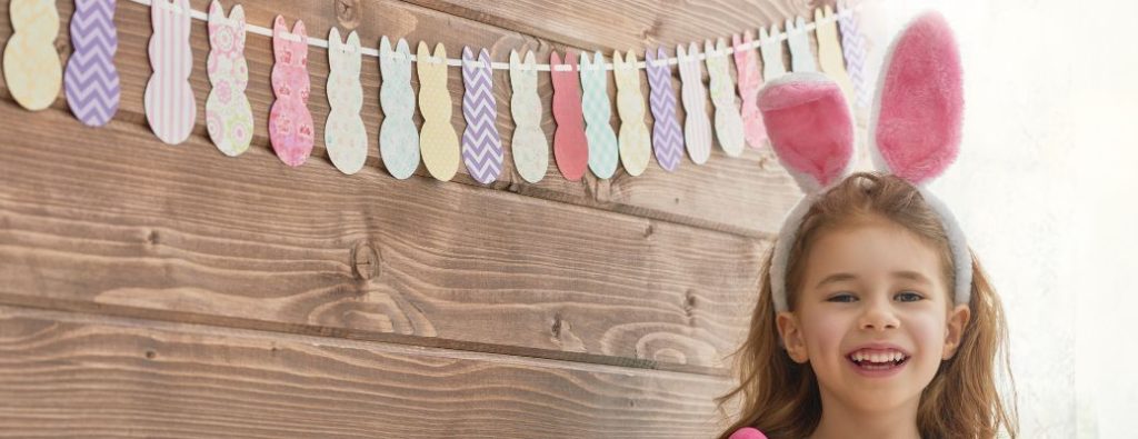 a child wearing bunny ears for Easter