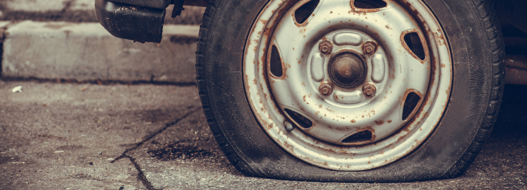 A close up of a flat tire