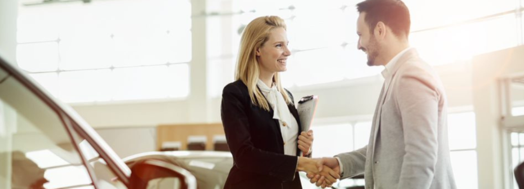 Customer and salesperson at a dealership