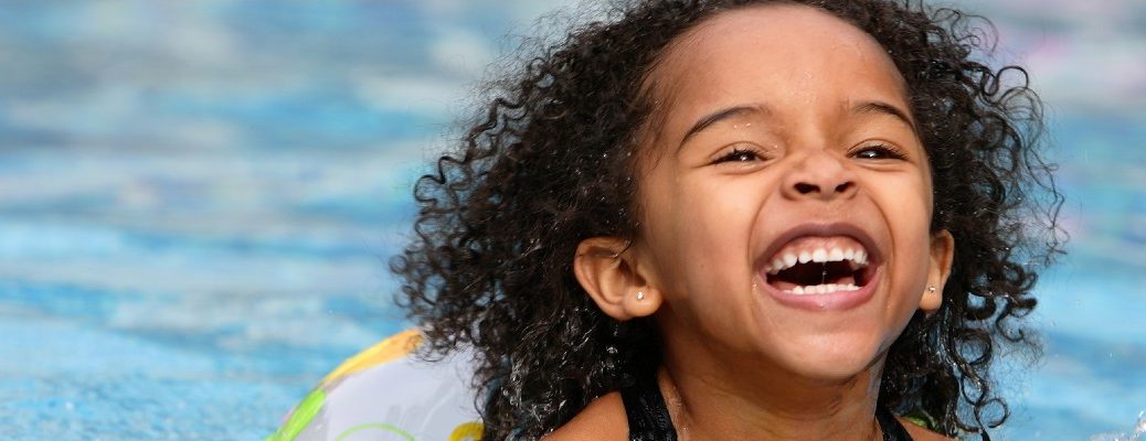 A stock photo of a child swimming.