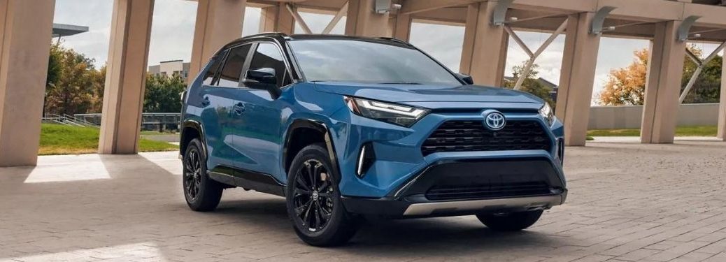 A blue 2022 Toyota RAV4 parked on a tiled floor