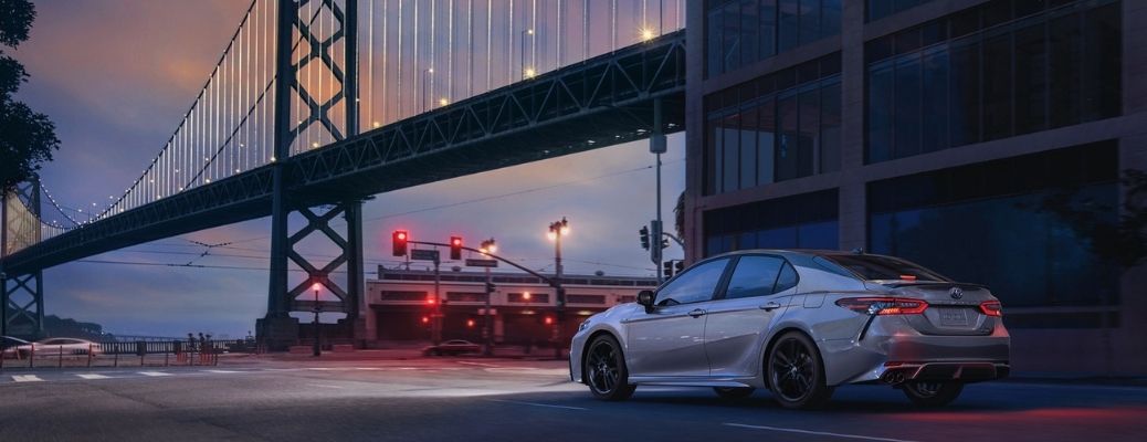 Toyota Sedan under a bridge