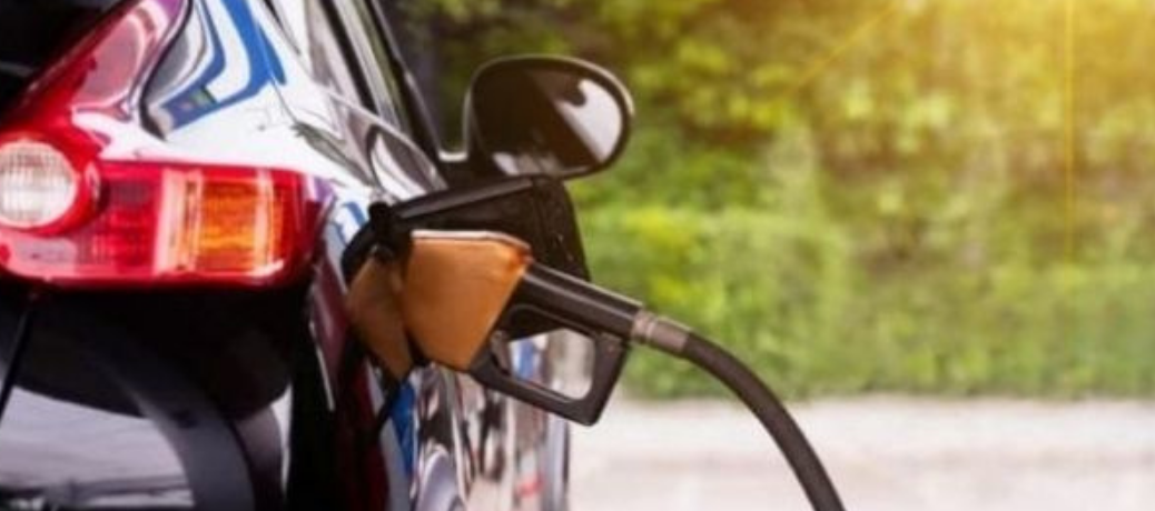 An image of pumping gas in car