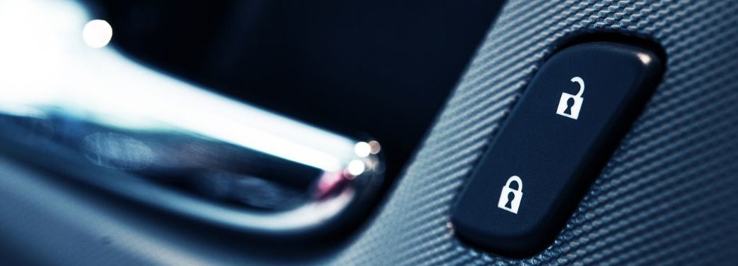 Lock and Unlock button on a car door.