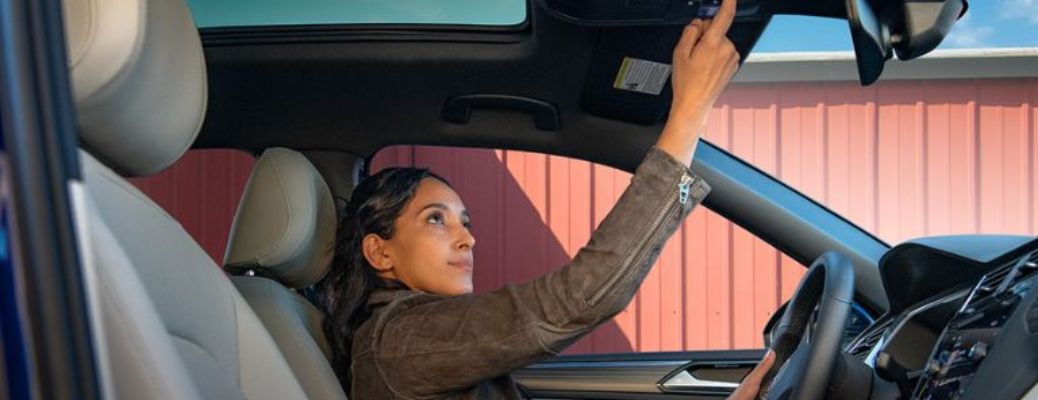 A woman fixing the mirror