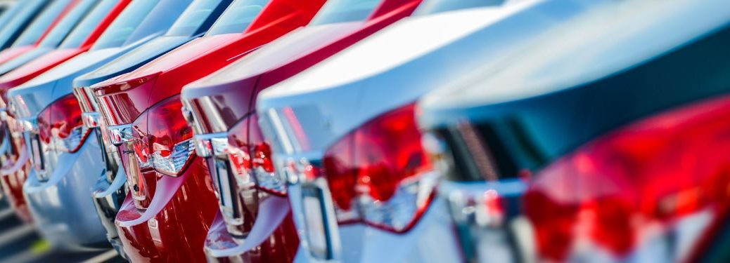 Rear end of the cars parked at a dealership