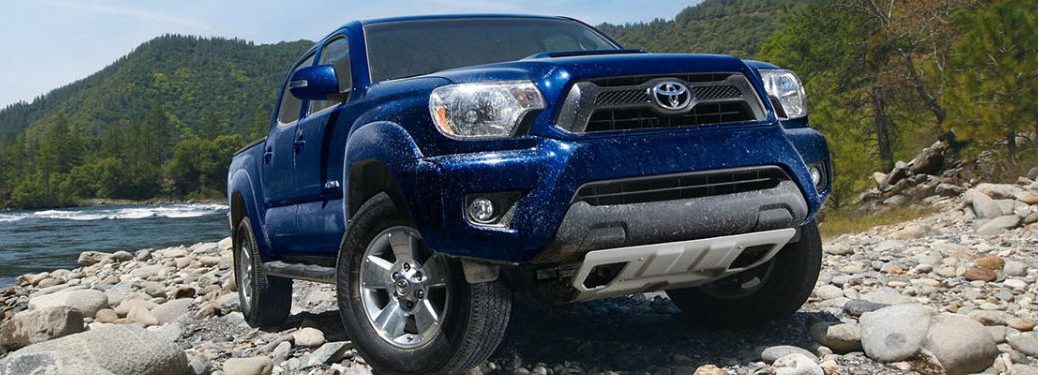 Front view of the 2015 Toyota Tacoma on a rocky terrain