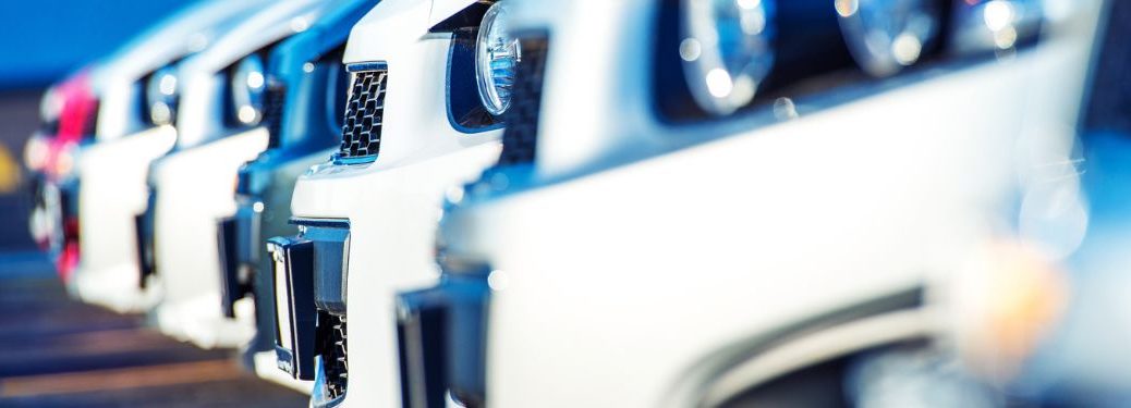 Close-up image of used cars in a car lot