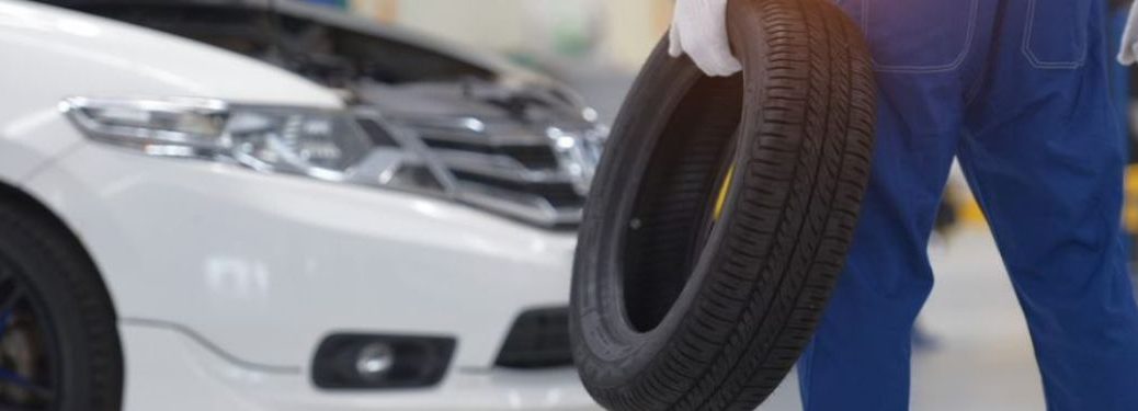 Technician holding a tire