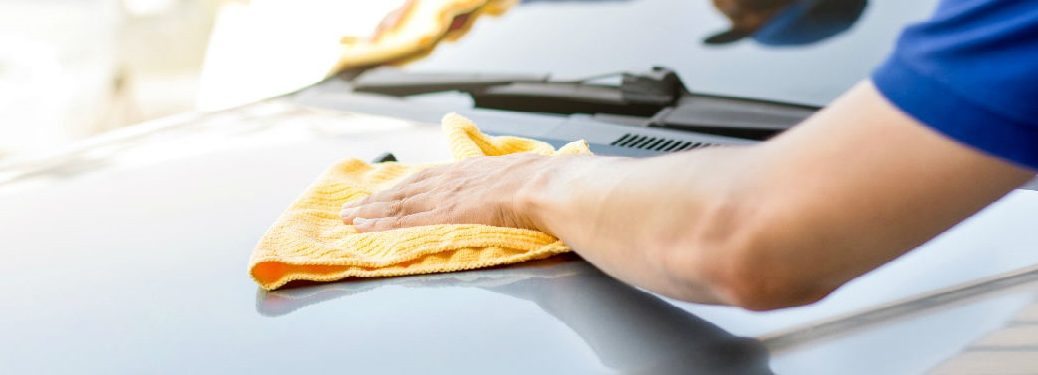 Person cleaning their car