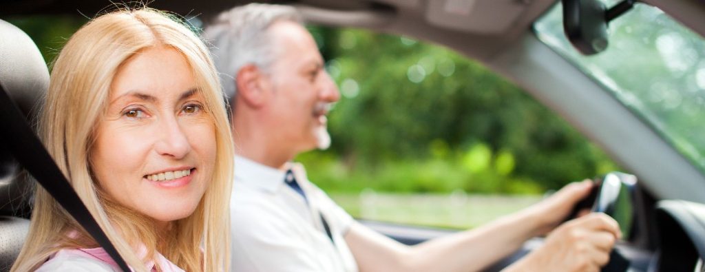 two people driving in a car