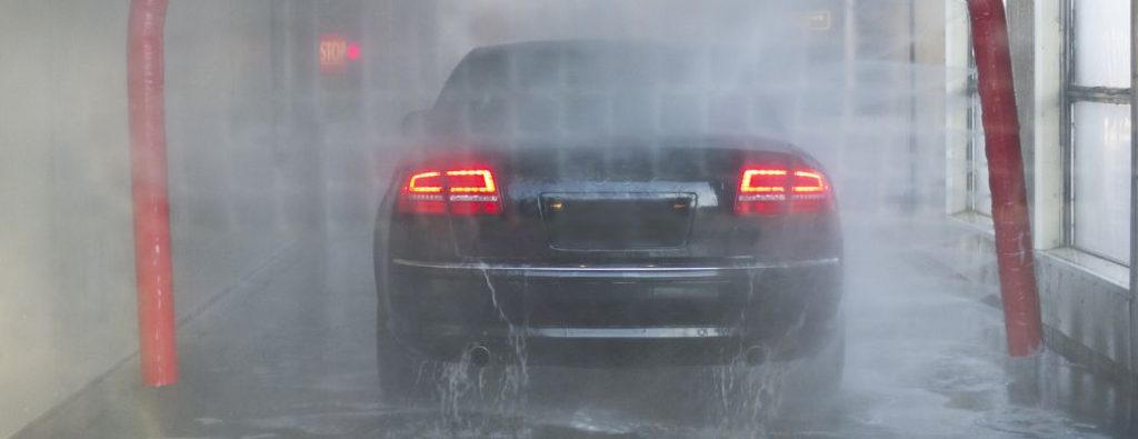 a car being rinsed in a washer