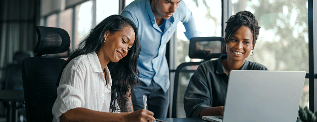 three people at a car dealership