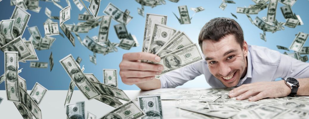 man holding cash and it's raining cash around him