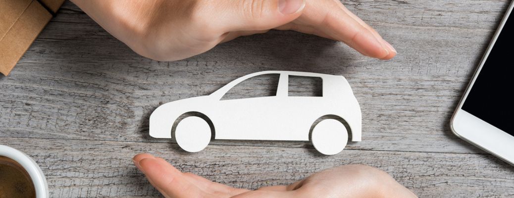 Hands at top and bottom of a vehicle symbol