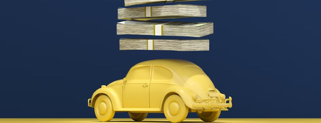 Bundles of cash on top of a toy car