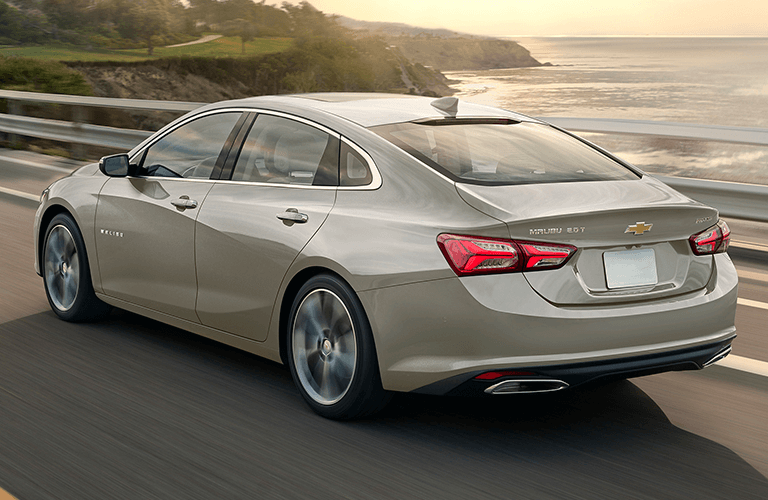 used Chevrolet Malibu driving by water