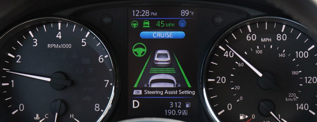 A photo of the center-mounted LCD screen showing the Nissan ProPILOT system.