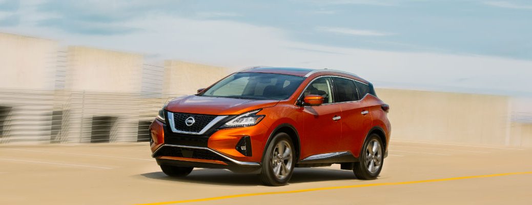 A left profile photo of the 2020 Nissan Murano in motion on the road.