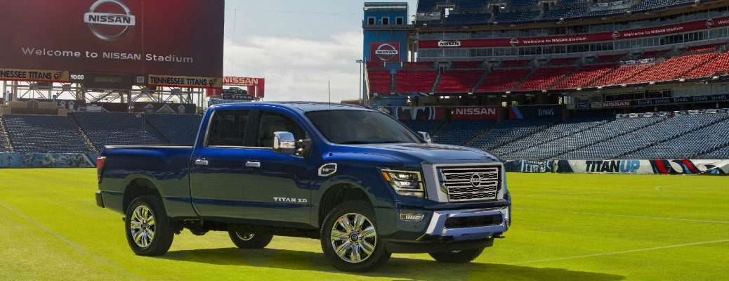 A photo of the 2020 Nissan Titan XD parked on a football field.