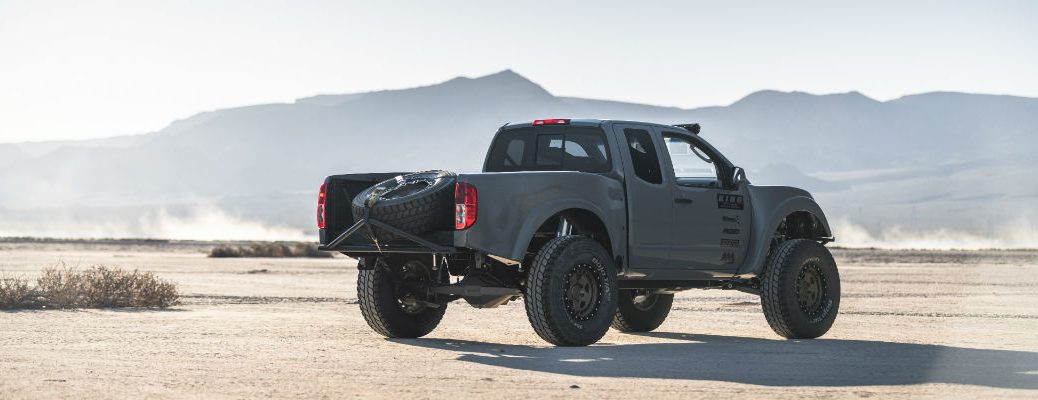 A right profile photo of the Nissan Frontier Desert Runner parked in the desert.
