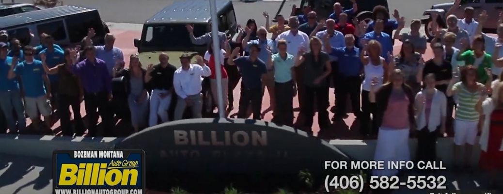 Billion Auto Group Employees standing outside the dealership